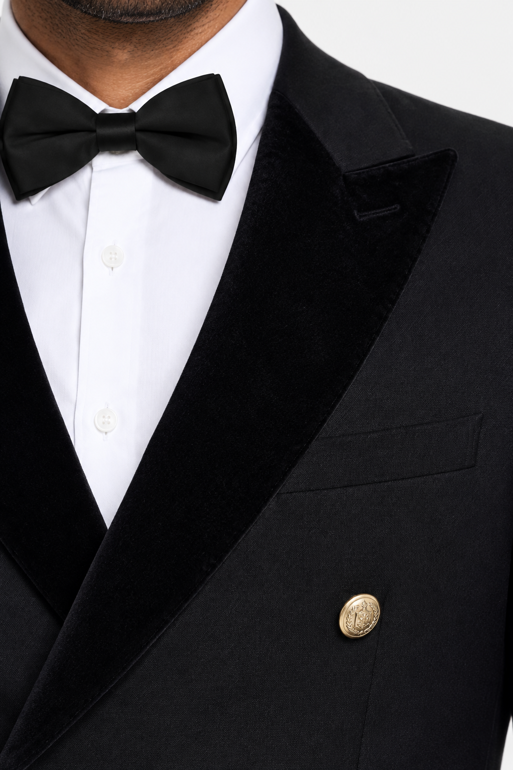 Close-up of the black peak lapel and upper gold button on the Double Breasted Tuxedo.